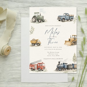May include: A rectangular invitation card featuring watercolor illustrations of a green tractor, blue pickup truck, yellow dump truck, bulldozer, red fire engine, and a steam train. The text reads BEEP BLEEP HOORAY! Miles is turning Three.