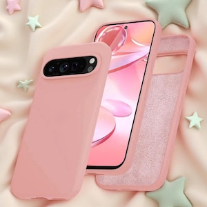 May include: A solid light pink smartphone case featuring a rectangular camera cutout with a black interior. The case is shown from the back, displaying a smooth matte finish, and from the front, revealing a textured, light pink interior lining.