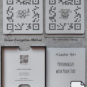 May include: Two square white coasters measuring 100 mm, each featuring a black pixelated QR code pattern with a central illustration of a couple. One shows a couple by a lighthouse, the other in a hot air balloon. Includes a black storage box.