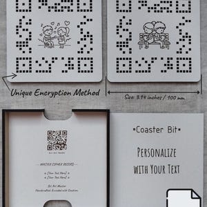 May include: Two square white coasters measuring 100 mm, each featuring a black pixelated QR-style pattern with a central illustration of a couple. One shows a couple singing, the other shows them sitting on a bench. Includes a box with a master cipher record.