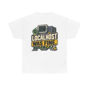 May include: A white t-shirt featuring a graphic on the back with a computer monitor, server, laptop, router, and a globe icon. The text reads "LOCALHOST WAS FINE." in bold letters, set against a yellow and black hazard-striped background.