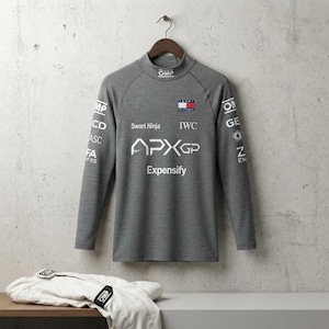 May include: A grey long-sleeve mock neck shirt featuring various white brand logos including OMP, Tommy Hilfiger, Swart Ninja, IWC, APXGP, and Expensify. A white garment with OMP branding is folded on the surface below the hanging grey shirt.
