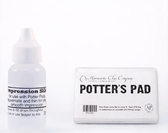 May include: A clear bottle of "Impression Sill" next to a white "Potter's Pad" container. The bottle has a white cap and contains a liquid. The container has the text "POTTER'S PAD" in bold black letters.