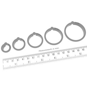 May include: Four silver metal cookie cutters in different sizes, labeled PDC-913, PDC-920, PDC-918, and PDC-932. The cutters are arranged from smallest to largest, with the smallest cutter measuring 2.5 cm in diameter and the largest cutter measuring 12 cm in diameter. A ruler is placed below the cutters, with measurements in millimeters.