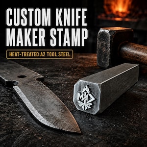 May include: A custom knife maker stamp made of heat-treated A2 tool steel. The metal stamp features a geometric flame logo on its face. It is positioned next to a metal knife blade and a heavy hammer. The text reads CUSTOM KNIFE MAKER STAMP.