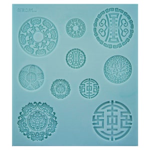 May include: A blue silicone mould with nine circular designs featuring intricate Chinese-inspired patterns. The mould is designed for creating decorative items like jewellery or cake decorations.