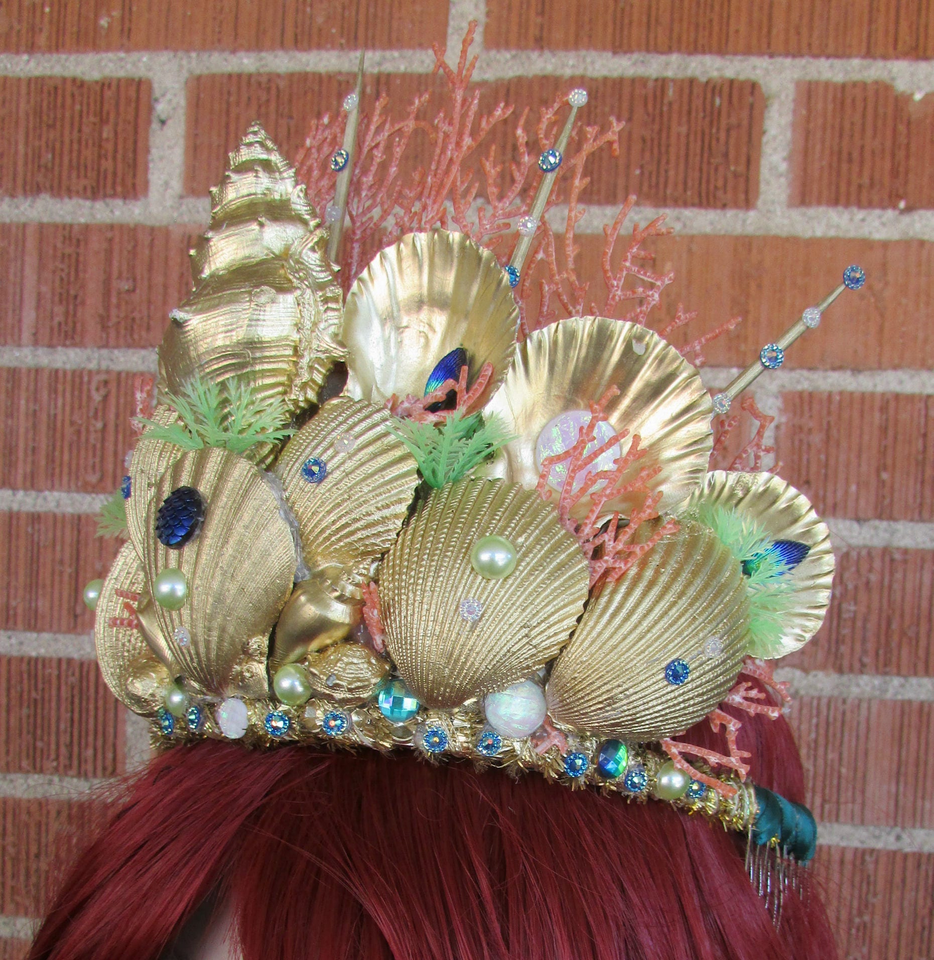 Mermaid headdress shells, gold, red hair, pearls on Craiyon