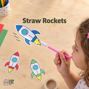 May include: A Straw Rockets activity set featuring three paper rocket cutouts in blue, red, and green with yellow flames. A pink flexible straw is used to launch a rocket cutout. The text Straw Rockets is printed in dark green.