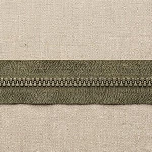 May include: An olive green zipper featuring a matching slider and pull tab. The zipper tape is made of a woven fabric, and the teeth are aligned in a continuous row. This functional fastener is designed for sewing projects and garment repairs.