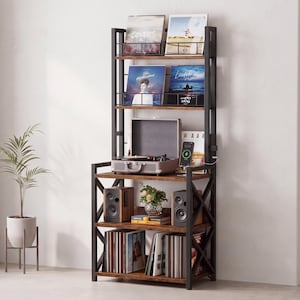 May include: A tall, multi-tiered storage unit with a black metal frame and dark wood-grain shelves. The unit features top racks for vinyl records, a middle shelf holding a portable record player and smartphone, and lower shelves for speakers and records.