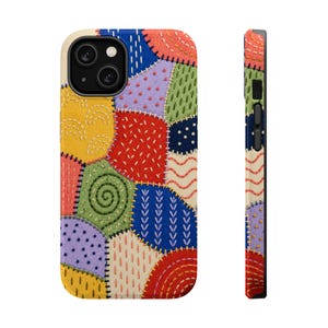 May include: A phone case featuring a colourful patchwork design with embroidered textures. The pattern consists of various shapes in red, blue, yellow, green, and purple, each decorated with distinct stitched motifs like swirls, dots, and lines.