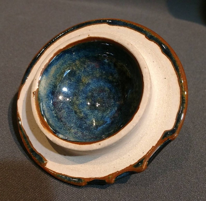 multi colored ceramic jar with decorative cut rim Deep blue