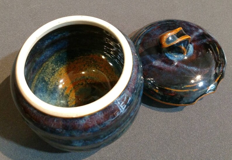 multi colored ceramic jar with decorative cut rim Deep blue