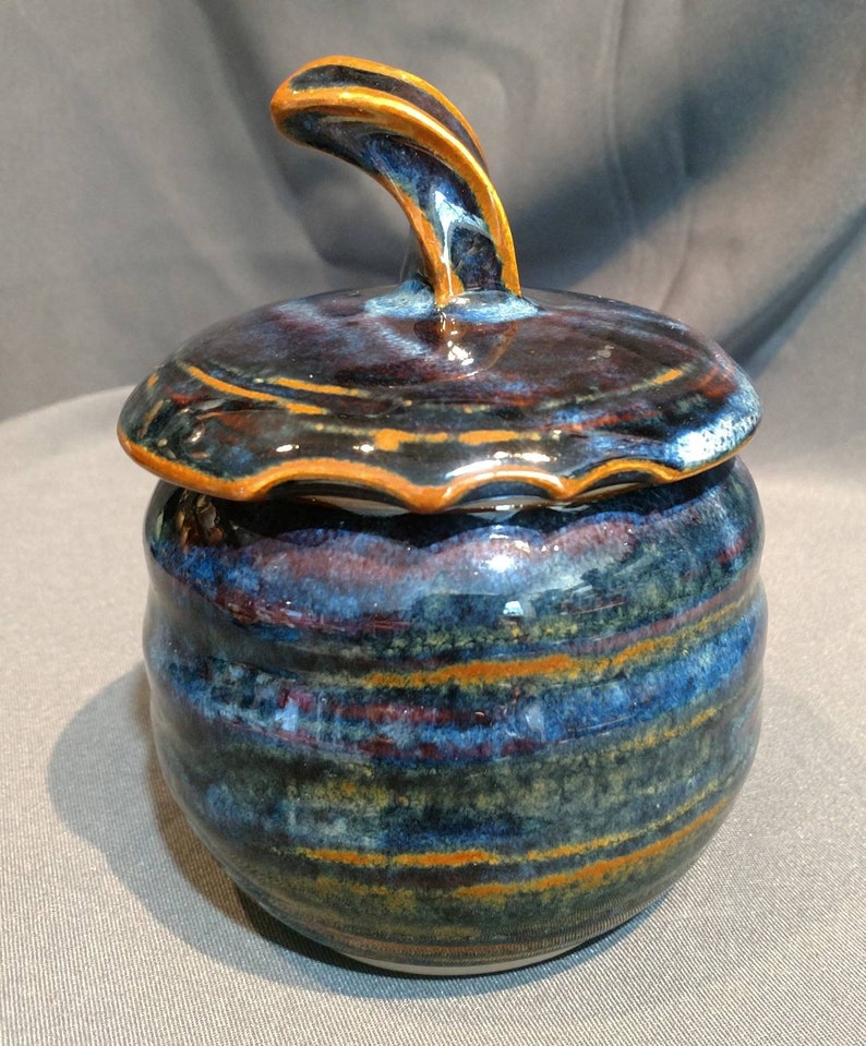 multi colored ceramic jar with decorative cut rim Deep blue