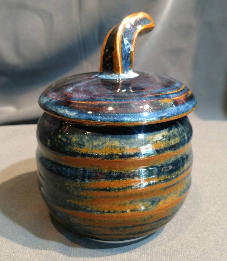 multi colored ceramic jar with decorative cut rim Deep blue