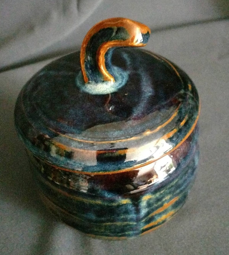 multi colored ceramic jar with decorative cut rim Deep blue