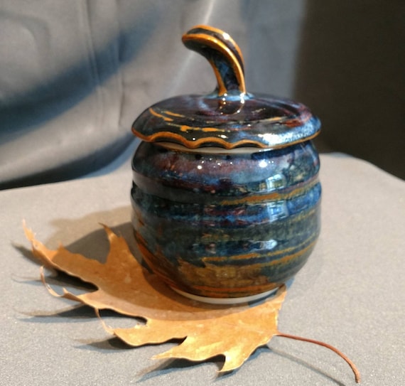 multi colored ceramic jar with decorative cut rim Deep blue