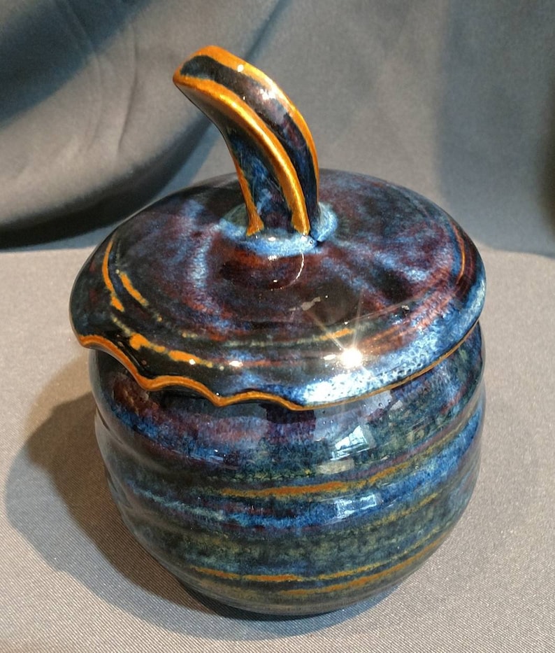 multi colored ceramic jar with decorative cut rim Deep blue