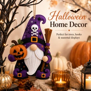 May include: A felt gnome ornament featuring a purple hat with a skull and crossbones, a white beard, and a black belt. The gnome holds an orange jack-o'-lantern and a brown broom. Text reads: Halloween Home Decor, Perfect for trees, hooks & seasonal displays.