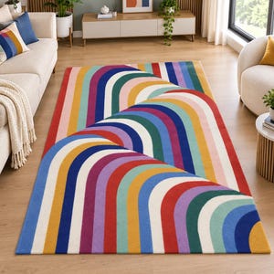 May include: A rectangular area rug featuring a repeating pattern of overlapping rainbow-colored arches in shades of red, orange, yellow, green, blue, purple, and white. The design creates a layered effect across the surface of the floor covering.