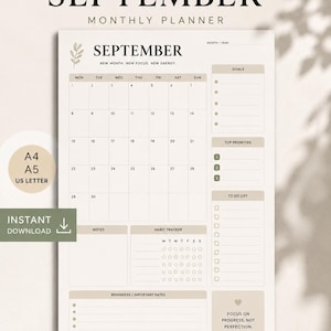 Peut inclure: Une page de planning mensuel pour septembre dans des tons beige neutres. La mise en page comprend une grille de calendrier, des sections pour les objectifs, les priorités, une liste de tâches, des notes, un suivi d'habitudes et des rappels. Le texte inclut 'SEPTEMBER', 'NEW MONTH, NEW FOCUS, NEW ENERGY' et 'FOCUS ON PROGRESS, NOT PERFECTION'.
