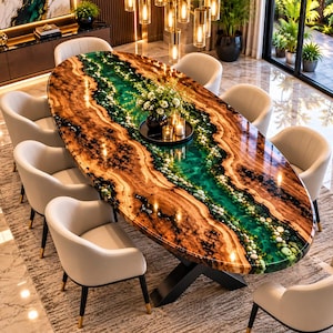 May include: An oval dining table featuring a live-edge wood slab with a central river of translucent green resin embedded with small river stones, supported by a black metal X-shaped base, surrounded by eight light-colored upholstered chairs.