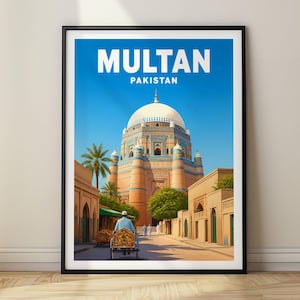 May include: A framed travel poster featuring the text MULTAN PAKISTAN at the top. The illustration depicts a large, domed, blue-tiled mausoleum with tan brick walls, surrounded by palm trees and a street scene with a person riding a colorful rickshaw.
