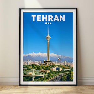 May include: A framed travel poster featuring the Milad Tower in Tehran, Iran, set against a clear blue sky and snow-capped mountains. The city skyline, a green park, a bridge, and a highway are visible below the tower, with the text TEHRAN IRAN.