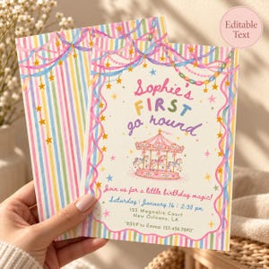 May include: A birthday invitation card featuring a watercolor carousel illustration, pastel striped borders, and hanging garlands with stars. The text reads: Sophie's FIRST go round, Join us for a little birthday magic, Saturday January 16, 2:30 pm, 123 Magnolia Court, New Orleans, LA, RSVP to Emma: 123.456.7890.