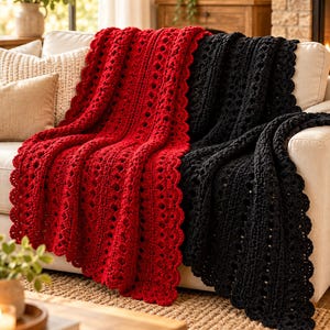 May include: A pair of crocheted blankets, one in vibrant red and one in deep black, featuring a repeating vertical openwork pattern and a scalloped edge. The blankets are draped over a sofa, showcasing the textured yarn construction.