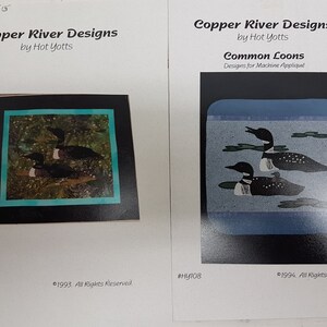 May include: Two designs by Copper River Designs by Hot Yotts. One features two loons in a natural setting, the other shows two loons in a blue water scene. The text "Common Loons" and "Designs for Machine Appliqué" are visible.
