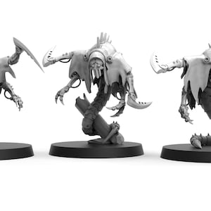 May include: Three unpainted grey miniature figures featuring robotic, serpentine bodies with segmented tails, clawed appendages, and tattered shroud-like coverings. Each figure stands on a circular black base, with the text Ready to Print and The Makers Cult visible.