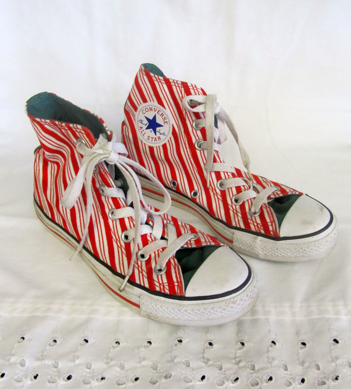 white trainers with red and green stripe