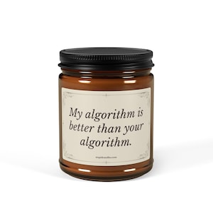 May include: A brown glass candle jar with a black screw-top lid. The off-white label features a decorative border and the black text: My algorithm is better than your algorithm. The website address stupidcandles.com is printed at the bottom.