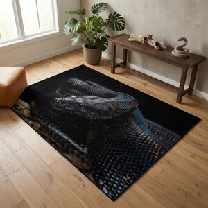 May include: A rectangular area rug featuring a high-resolution, detailed photographic print of a large, dark-scaled snake coiled in a resting position. The snake displays intricate black and charcoal textures with subtle highlights across its body.