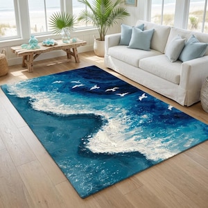 Puede incluir: Una alfombra rectangular que presenta una escena oceánica abstracta con agua en tonos azul profundo y turquesa, olas de espuma blanca texturizadas y una bandada de aves blancas volando. El diseño imita un paisaje marino pintado con pinceladas visibles.