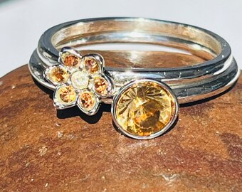 Vintage rings size 10 1/2 flower and round silver plated bands very good condition champagne colored resin gems clear cz