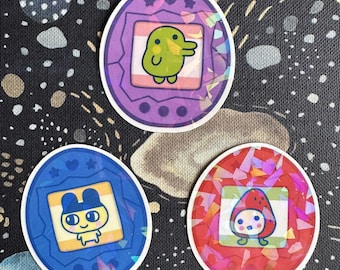 Tamagotchi - Naklejka winylowa | Wykończenie holograficzne