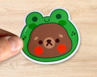 Kawaii Bear wearing a frog costume sticker, Cute Vinyl Decal for Animal Lovers, Cottagecore Aesthetic, Frogcore Vibes