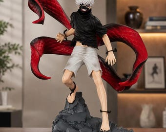 May include: A detailed anime-style figurine of a character with white hair and a black mask, wearing a black shirt and white shorts. The figure stands on a dark, jagged rock base and features large, flowing red tentacle-like appendages extending from the back.