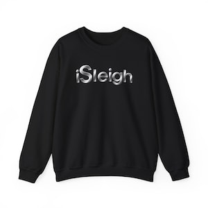 May include: A black long-sleeve crewneck sweatshirt featuring the word iSleigh printed across the chest in a metallic silver gradient font with a reflective, polished chrome appearance and rounded, modern typography.
