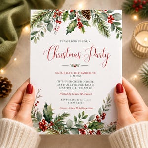 Op de afbeelding: Een witte uitnodigingskaart voor een kerstfeest met aquarelillustraties van dennentakken, hulstbladeren, rode bessen en een dennenappel. De tekst luidt: Please join us for a Christmas Party, Saturday, December 20, 6:30 PM, The Evergreen House, 248 Holly Ridge Road, Nashville, TN 37212, Hosted by Claire & Daniel, RSVP by Dec 12 to Claire 615-555-2841, Dinner, drinks & holiday cheer.
