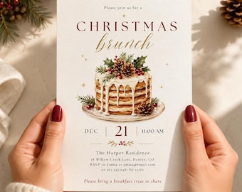 May include: A rectangular Christmas brunch invitation card featuring a stack of pancakes topped with pinecones and holly. The text reads: Please join us for a CHRISTMAS brunch, DEC 21 11:00 AM, The Harper Residence, 18 Willow Creek Lane, Denver, CO.