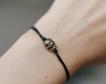 Skull bracelet, black string bracelet with bronze skull charm bead, goth emo bracelet, gift for her, adjustable bracelet minimalist jewelry