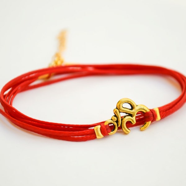 OM bracelet, wrapped bracelet, gold tone Om charm, Hindu symbol, red ohm bracelet, gift for her, yoga bracelet, luck, ohm spiritual jewelry