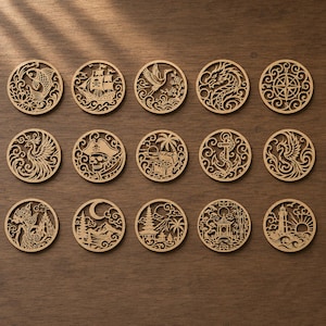 May include: A collection of fifteen circular light brown wooden cutouts featuring intricate laser-cut designs including a koi fish, pirate ship, crane, dragon, compass, phoenix, skull, treasure chest, anchor, lighthouse, and various landscape scenes.