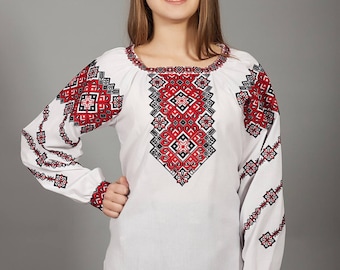 White vyshyvanka. Traditional Ukrainian embroidered women's blouse Ethnic sorochka shirt. Ukrainian clothes. Embroidered blouse cross-stitch