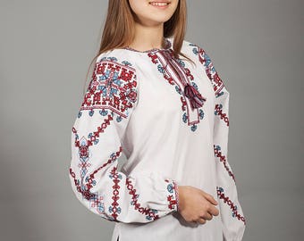 White vyshyvanka. Traditional Ukrainian embroidered women's blouse Ethnic sorochka shirt. Ukrainian clothes. Embroidered blouse cross-stitch