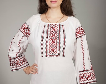 Women white vyshyvanka. Traditional Ukrainian women's blouse. Ethnic sorochka shirt. Ukrainian clothes. Embroidered blouse cross-stitch