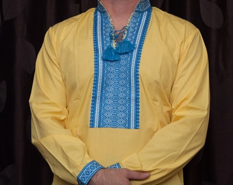 Yellow shirt with blue embroidery. Vyshyvanka yellow-blue shirt. Ukrainian embroidered shirt Folk traditional embroidery. Ukraine clothes.